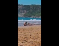 Woman bikini lie down beach photo shoot