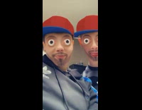 Couple face filter bulging eyes red hat