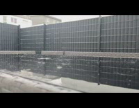 Raindrops on glass table scatter grey fence