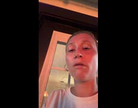 Woman reacts to large fire on yard