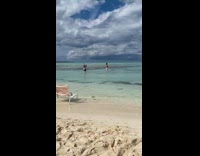 Guy white shorts splash beach water chair