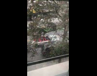 Man dressed as michael meyers in red leather car
