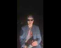 Guy chugs jack daniels bottle white straw