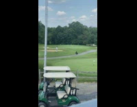 Guy sweater jump shot on golf course