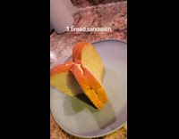 Three bread sandwich on plate