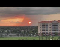 Sunset behind the shower of the rain