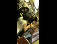 Group of teen boys start mosh pit and sing together inside subway train