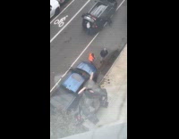 Men near big inflatable rat on sidewalk