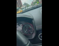 Taxi car gets stuck on the road divider with police around