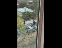 Man dances and smokes for a music video shoot