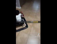 Baby runs away in walker with envelope 