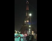 Woman red dress middle of road Eiffel Tower
