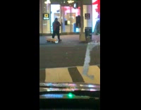 Guy walks with toy truck down side walk