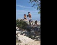 Woman sit on rock do finger movements yoga