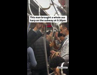 Guy rides subway brings and play harp