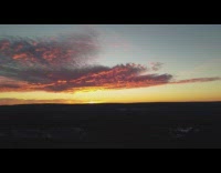 Drone captures sunrise orange and blue sky