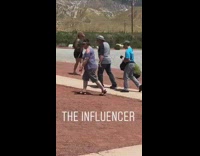 Girl twirling back and forth large dinosaur 