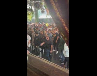 Guy in front of crowd at music festival shuffling