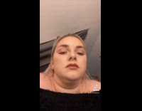 Girl thrusts her neck back and forth 