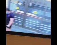 Guy flexes arm security camera screen 