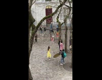 Woman in yellow dress tiktok dance at the park