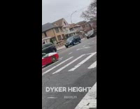 Red derby racer car drives on street and makes a turn