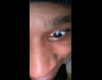 Grey shirt guy peeks through doorway 