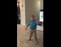 Little girl blue polo shirt khaki shorts dancing hitting the woah