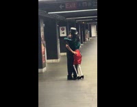 Man dance with skeleton at subway station