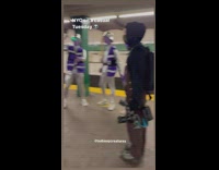 4 guys dance in purple and silver outfit 