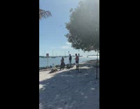 Girl wearing orange dress poses for photo