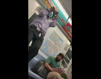 Guy does pull ups on subway railing 