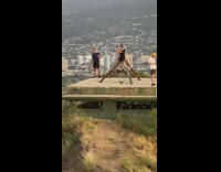 Guy blue shirt girl taking pictures