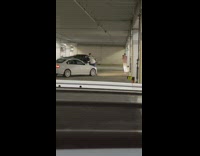 Guy poses in front of car