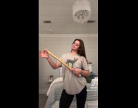 Woman makes make shift guitar 