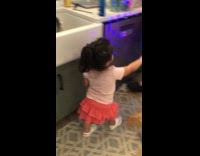 Girl explores house walks around with flashlight 