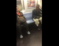 Man blue jacket hands on chin stares at camera with wide eyes