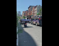 Guy on motorcycle new television on back 