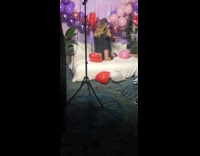 Girl poses on bed for photo