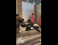 Woman sells clothes online inside a warehouse