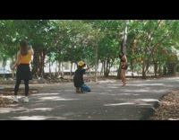 Girl black skirt red heels asphalt park 