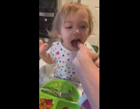 Daughter has cute reaction to being fed bacon