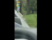 Yellow beanie girl stands rock park talks 