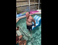 Family vacation balancing on pool floater