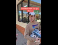 Guy free beer drinks from beer bong