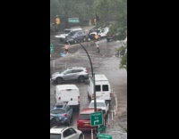 Random guy surfboarding on road flash flood