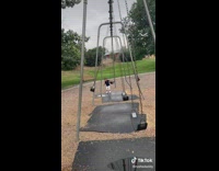Young boy try to avoid swing playground