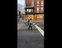 Man juggles pins in middle of road