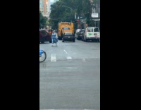 Car on street with driver door open upwards