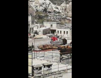 Woman red dress rooftop photoshoot